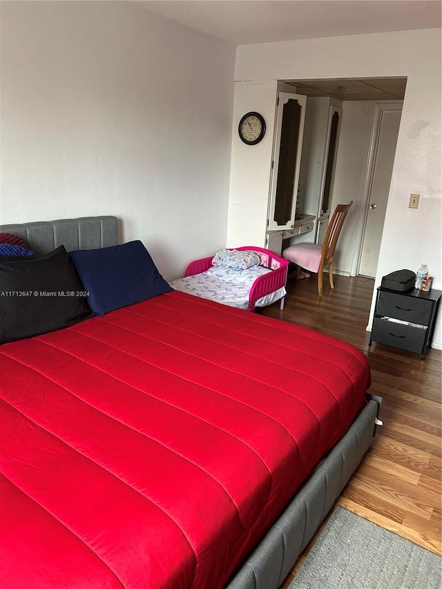 bedroom featuring wood-type flooring