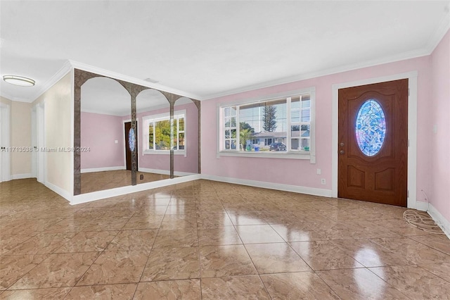 foyer featuring crown molding