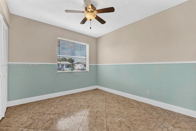 spare room with ceiling fan