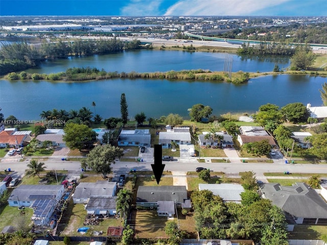 birds eye view of property featuring a water view