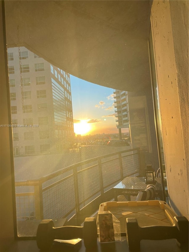 view of balcony at dusk