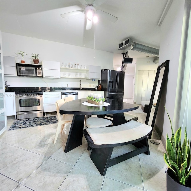 kitchen featuring visible vents, white cabinets, appliances with stainless steel finishes, open shelves, and dark countertops