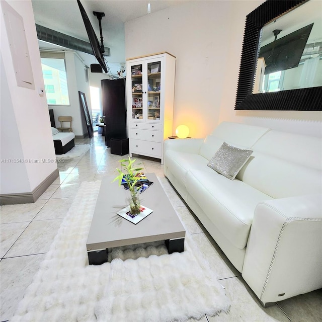 living area with light tile patterned floors