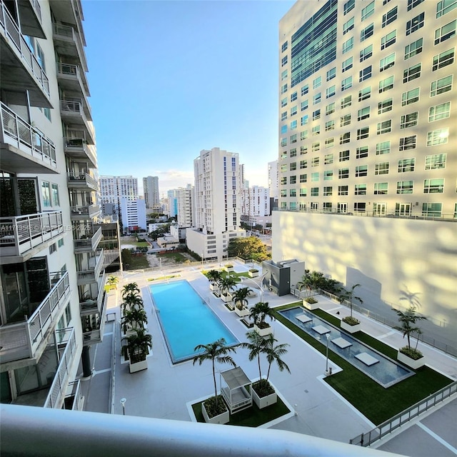 view of pool with a view of city