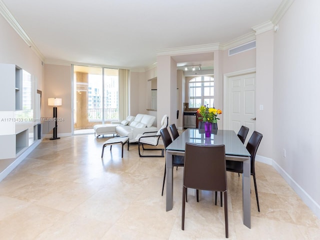 dining room featuring crown molding