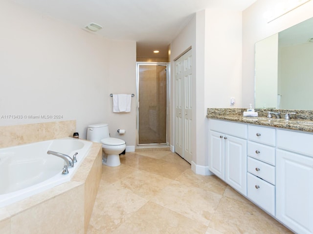 full bathroom featuring vanity, separate shower and tub, and toilet