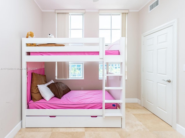 bedroom with ornamental molding