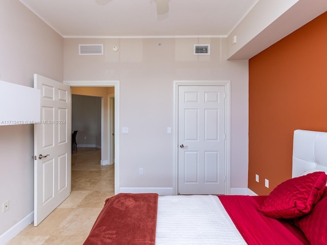 bedroom with ceiling fan and crown molding