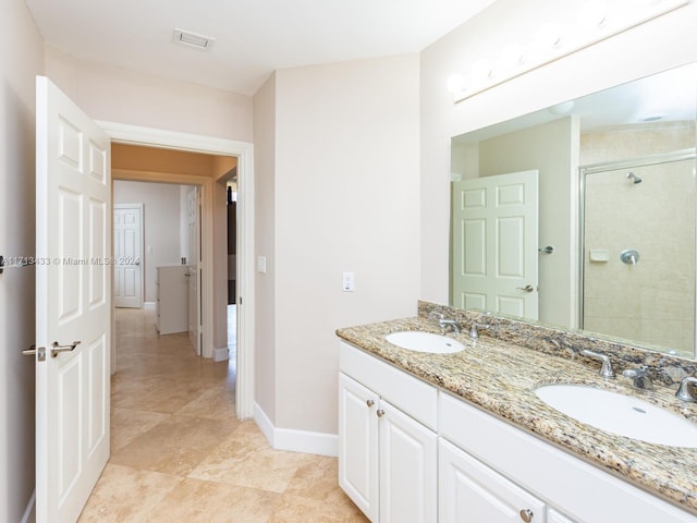 bathroom with vanity and walk in shower