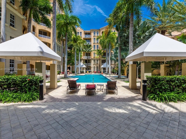 view of swimming pool featuring a gazebo and a patio area