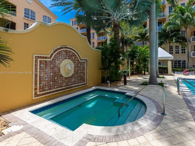 view of pool featuring a hot tub