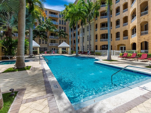 view of swimming pool with a patio