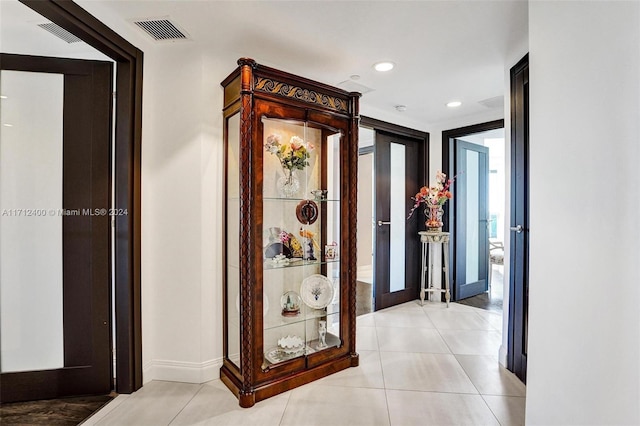 hallway featuring light tile patterned flooring