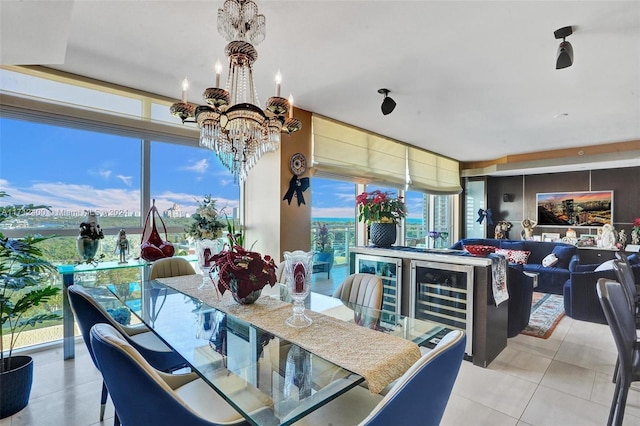 dining area with light tile patterned floors and a notable chandelier