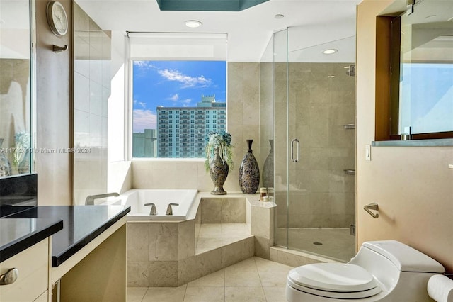 bathroom featuring plus walk in shower, tile patterned floors, and toilet