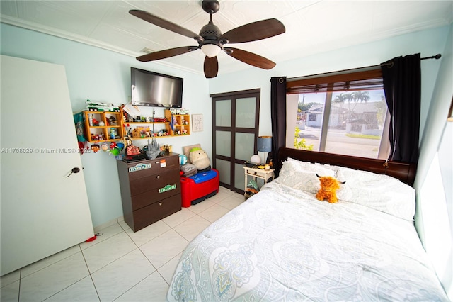 bedroom with light tile patterned floors and ceiling fan