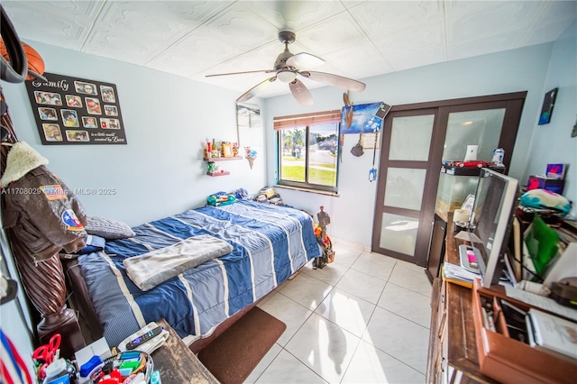 bedroom with light tile patterned flooring and ceiling fan