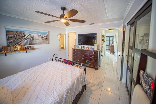 bedroom with ceiling fan, visible vents, an ornate ceiling, and ornamental molding