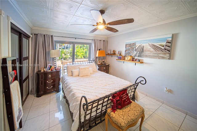 bedroom with crown molding, light tile patterned floors, an ornate ceiling, and ceiling fan