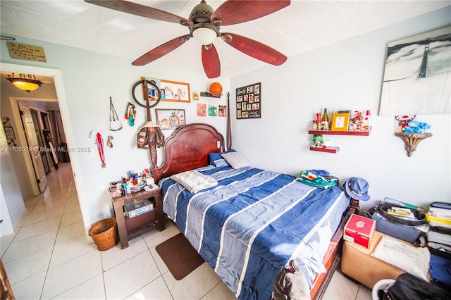 bedroom with light tile patterned floors and ceiling fan