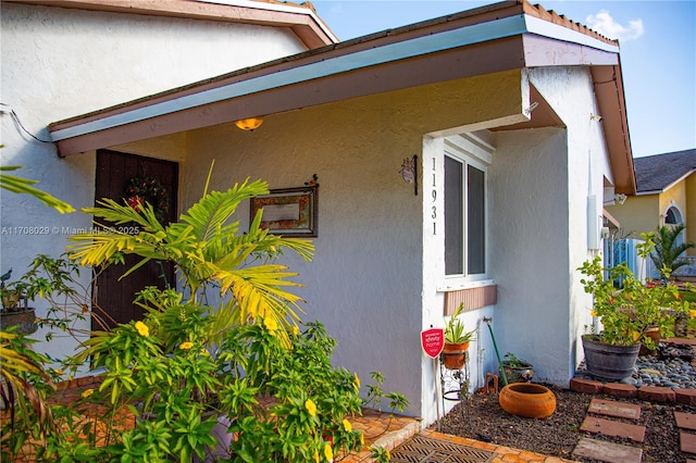 view of side of home with stucco siding