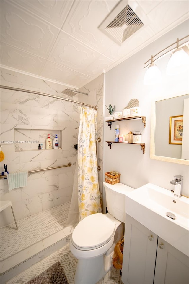 full bathroom featuring visible vents, toilet, vanity, and a tile shower