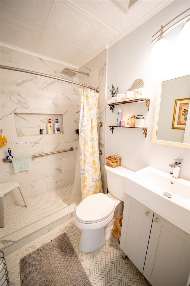 bathroom featuring vanity, toilet, visible vents, and a tile shower