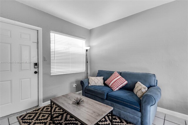 living room with light tile patterned floors