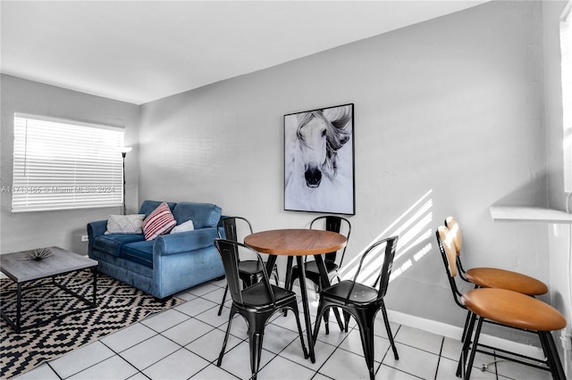 dining area with light tile patterned floors