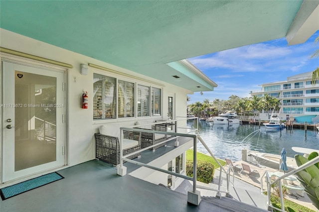 balcony featuring a water view