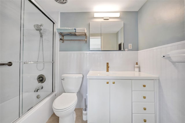 full bathroom with vanity, toilet, and enclosed tub / shower combo