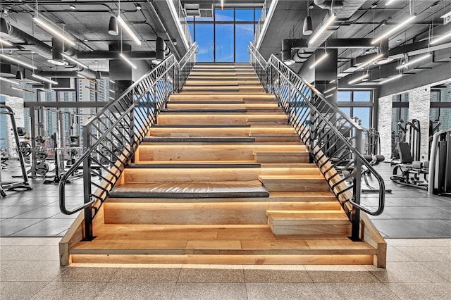 staircase with a towering ceiling