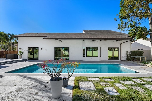 view of swimming pool featuring ceiling fan and a patio