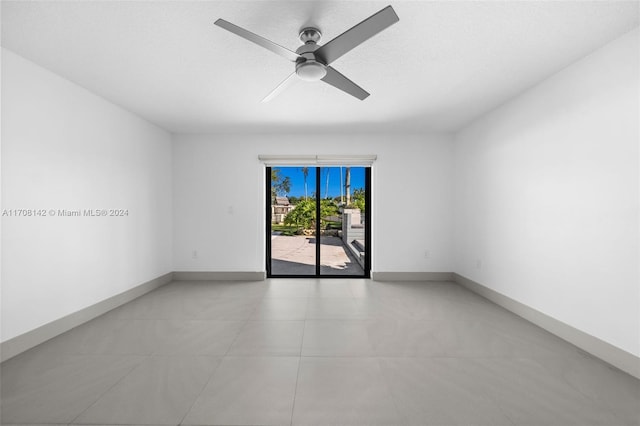 spare room with ceiling fan