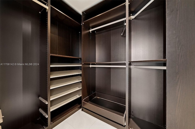 spacious closet with tile patterned flooring