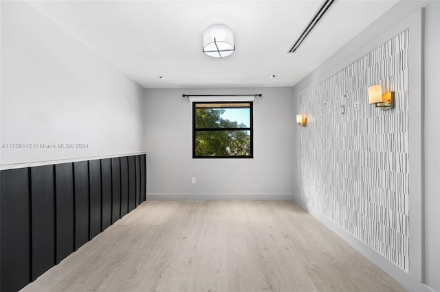 unfurnished room featuring light wood-type flooring