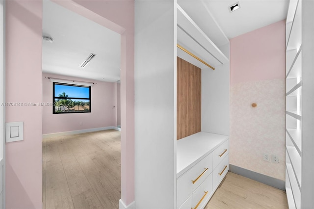 corridor featuring light hardwood / wood-style flooring