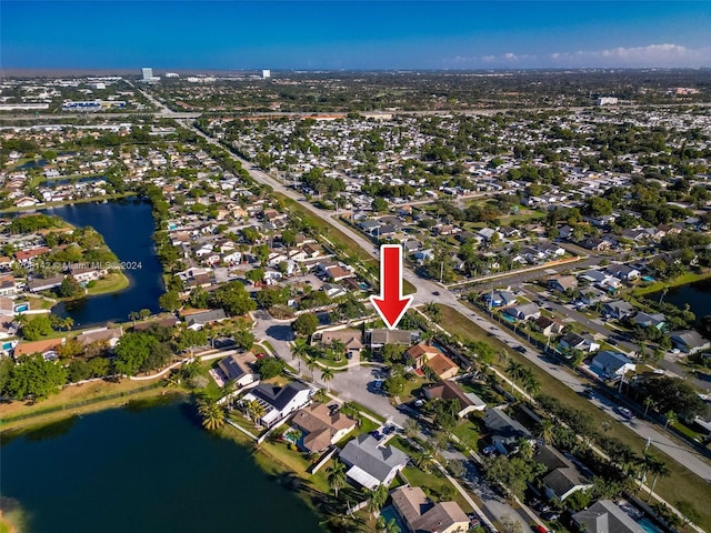 birds eye view of property featuring a water view