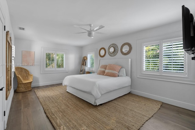 bedroom with ceiling fan and hardwood / wood-style flooring