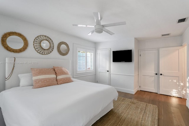 bedroom with ceiling fan and wood-type flooring