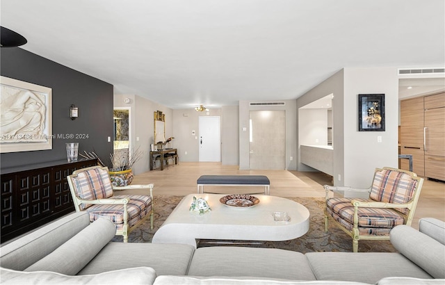 living room with light hardwood / wood-style flooring