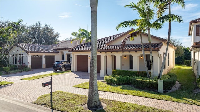 view of front of home featuring a garage and a front lawn