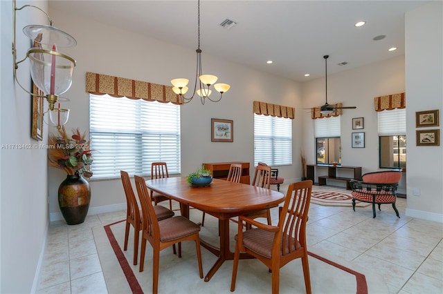 dining space featuring an inviting chandelier and light tile patterned floors