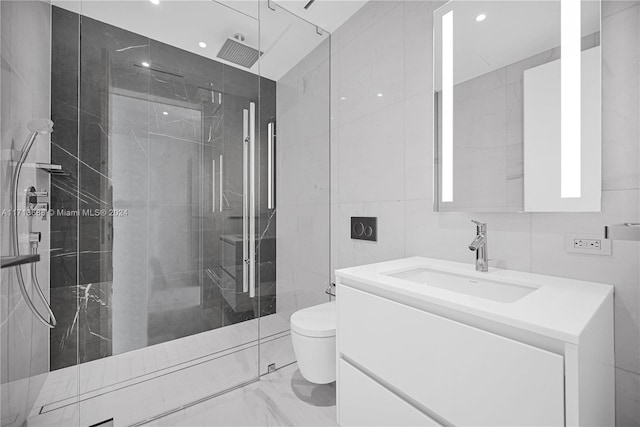 bathroom featuring walk in shower, vanity, toilet, and tile walls