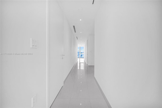 hallway featuring light tile patterned floors