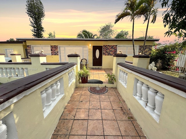 view of patio terrace at dusk