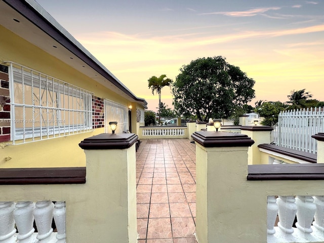 view of patio terrace at dusk