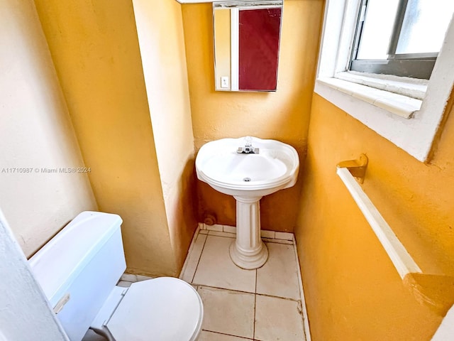 bathroom featuring tile patterned floors and toilet