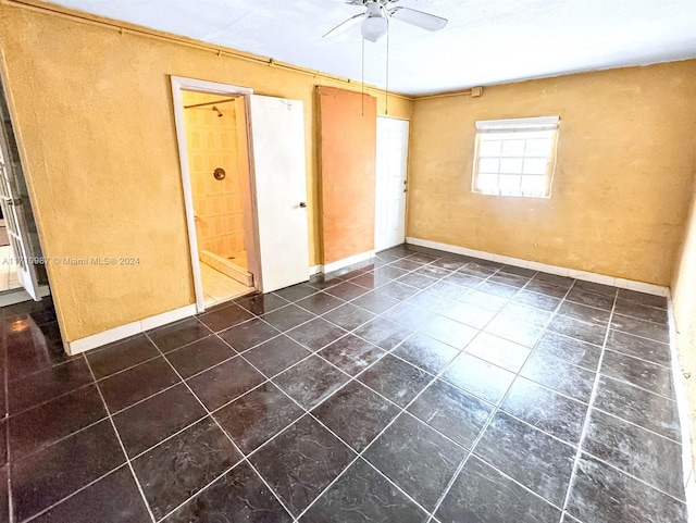 spare room featuring ceiling fan