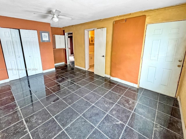 unfurnished room with ceiling fan